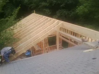 Framing a new roof addition that ties into an existing shingle roof in Malone